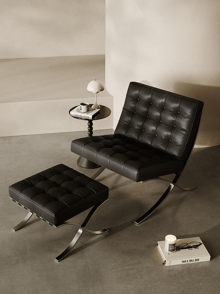 Classic Modern Barcelona Chair And Footstool, Black LeatherDescription



The Barcelona Chair is a timeless piece that combines classic design with style and comfort. This black leather armchair comes with thick removable pa