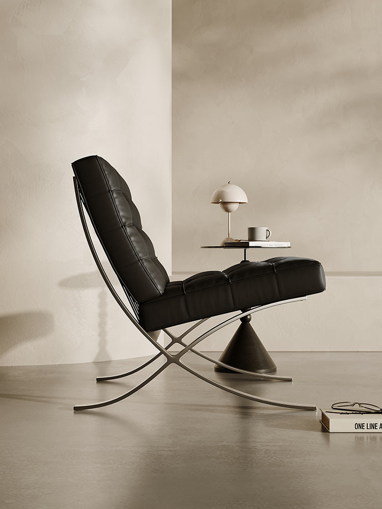 Classic Modern Barcelona Chair And Footstool, Black LeatherDescription



The Barcelona Chair is a timeless piece that combines classic design with style and comfort. This black leather armchair comes with thick removable pa