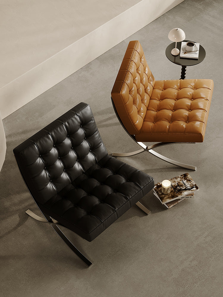 Classic Modern Barcelona Chair And Footstool, Black LeatherDescription



The Barcelona Chair is a timeless piece that combines classic design with style and comfort. This black leather armchair comes with thick removable pa